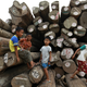 Boys play on teak logs piled at a port in Yangon April 18, 2013. REUTERS/Soe Zeya Tun